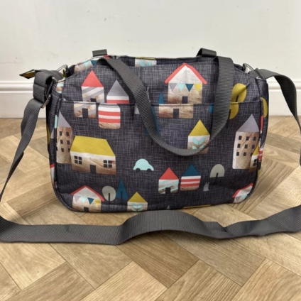 NEW Cosatto Deluxe Changing Bag With Mat - Huggee Houses - Charcoal Grey